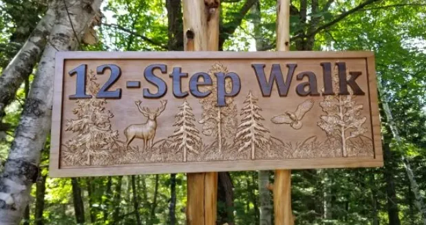 a carved sign that says "12-Step Walk"