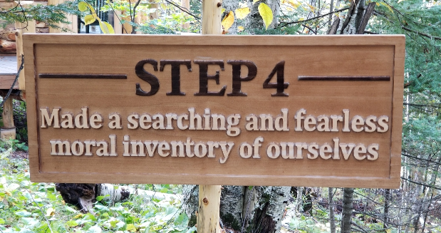 a carved wooden sign that says "Step 4: Made a searching and fearless moral inventory of ourselves."