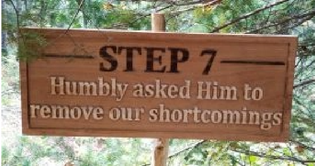 a carved wooden sign that says "Step 7: Humbly asked Him to remove our shortcomings."