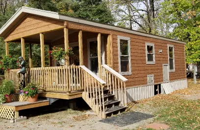 a small cabin with a covered deck.