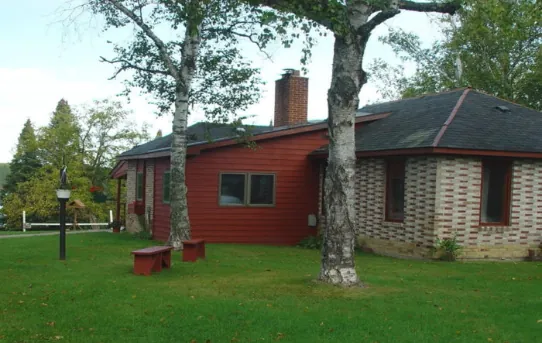 a residential structure with red siding.